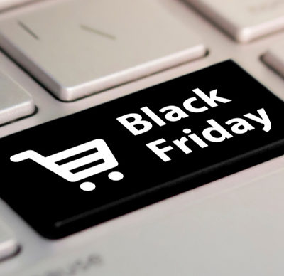 Close-up view on conceptual keyboard - Black Friday button. Online shopping at a discount. Sale day in the online store.